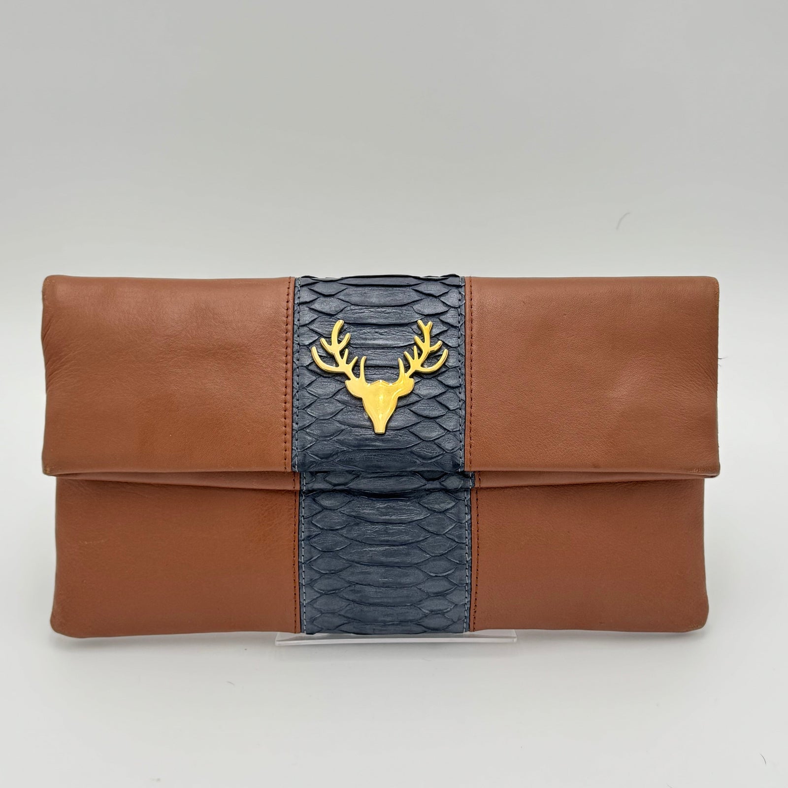 hobo raine sterling leather foldover clutch bag Crossbody Clutch, full-grain Black leather, made in USA fashion clutch with a nod to Ethiopian style Bottega Veneta Andiamo Raffia Clutch